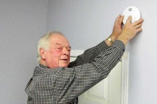 Addington Highlands Reeve Hogg testing his smoke alarms for Fire Prevention Week